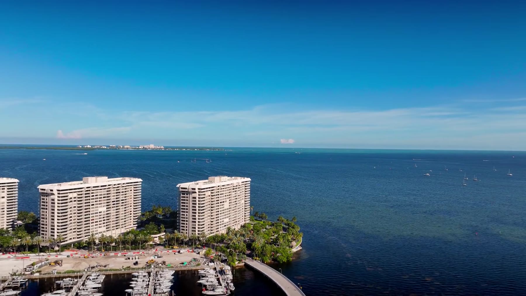 South Florida waterfront homes, palms and pools at dusk
